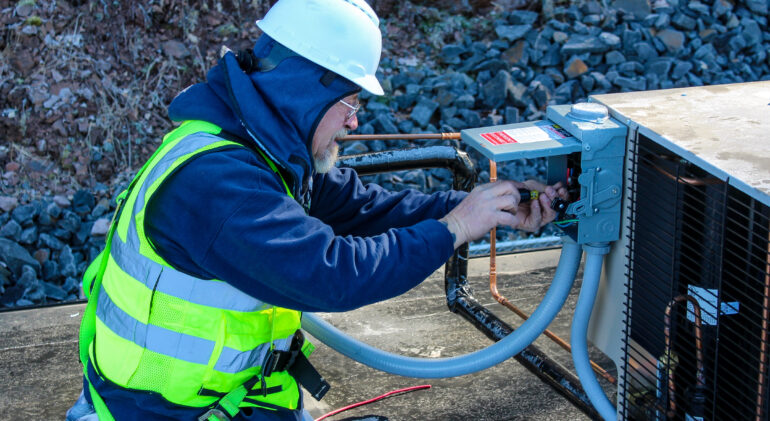 MDi technician working onsite fixing equipment