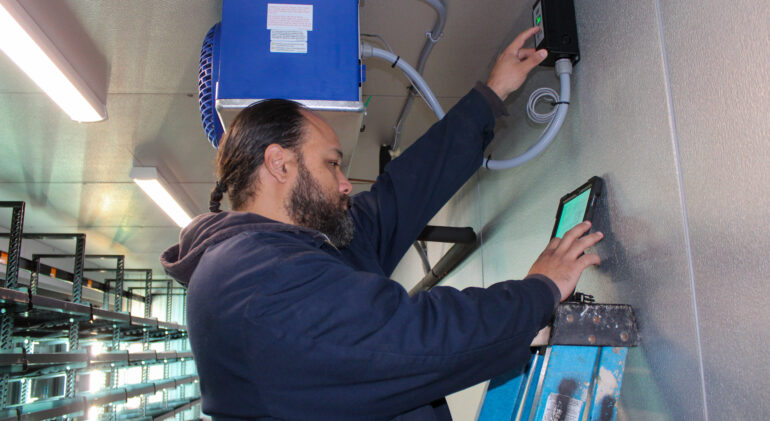 Technician testing A/C system